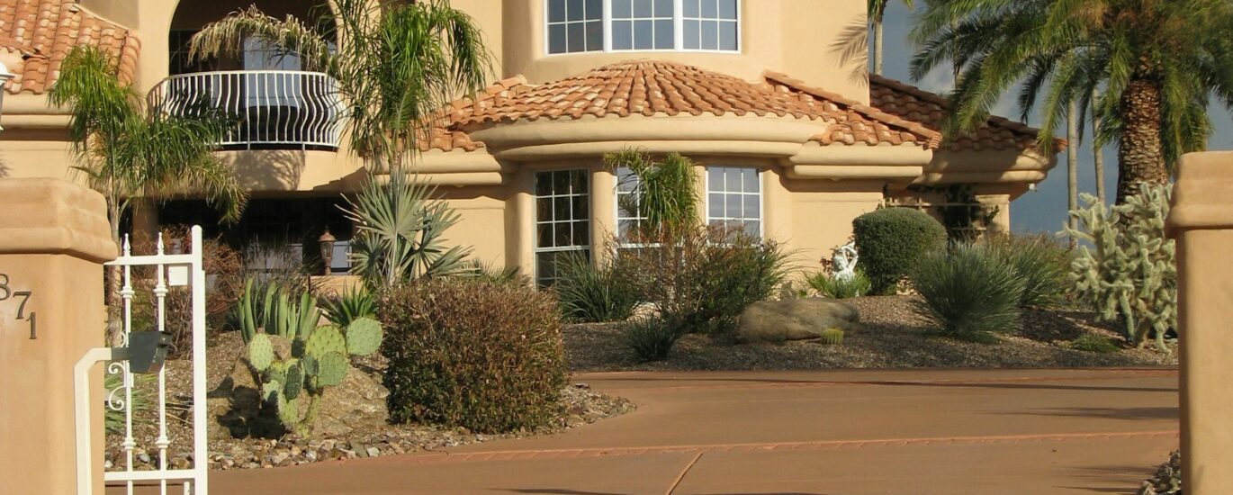 Desert home with garage door and palm trees in Palm Springs Southern California